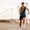 Fit Man Sprinting Exercising Down Boardwalk