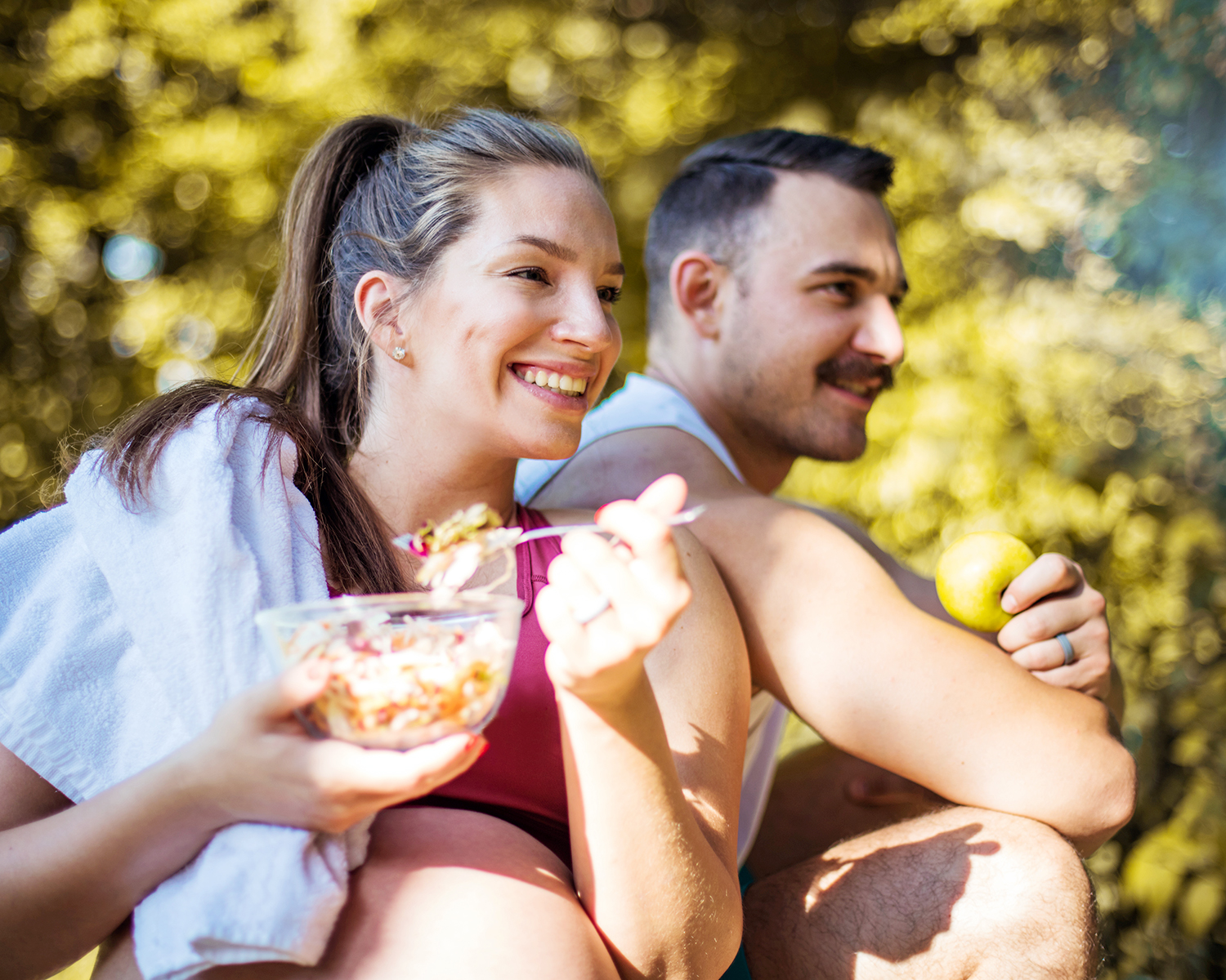 Couple Eating Outdoors with Healthy Food and Diet
