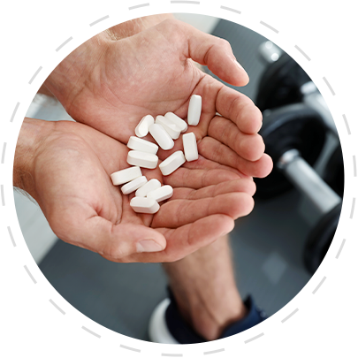 Man Holding Pur Pharma Anabolic Oral Tablets at Gym