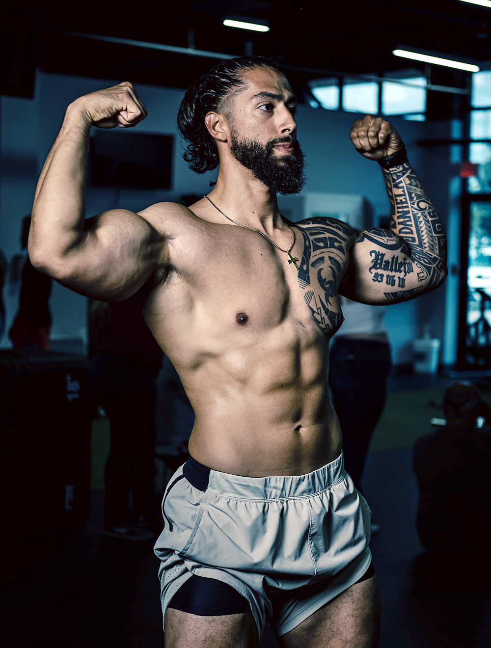 Jacked Bodybuilder Flexing at Gym with Tattoos