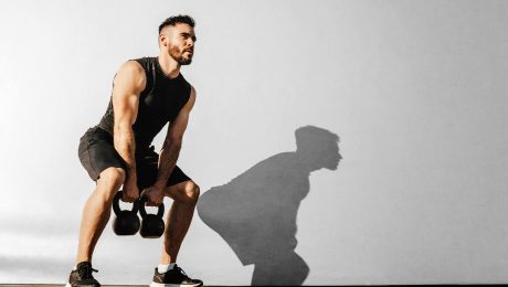 Man with kettle bells
