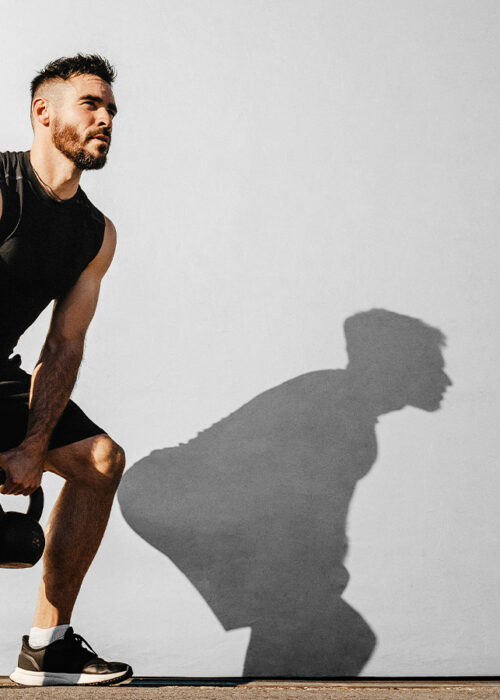 Man with kettle bells