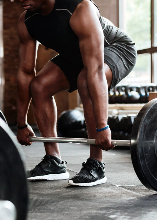 Man doing a squat in the gym